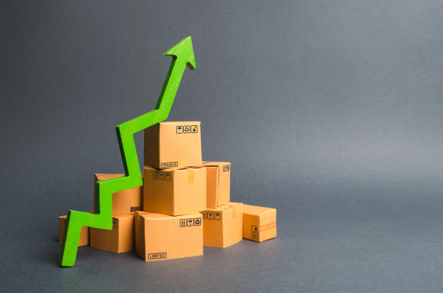 pile-cardboard-boxes-green-up-arrow-growth-rate-production-goods-products_72572-1020