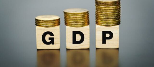 gdp-text-wooden-block-with-coins-top-business-finance-